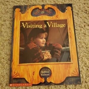 visiting a village children's book. Good condition pre loved